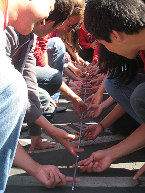A group doing the Helium Stick activity